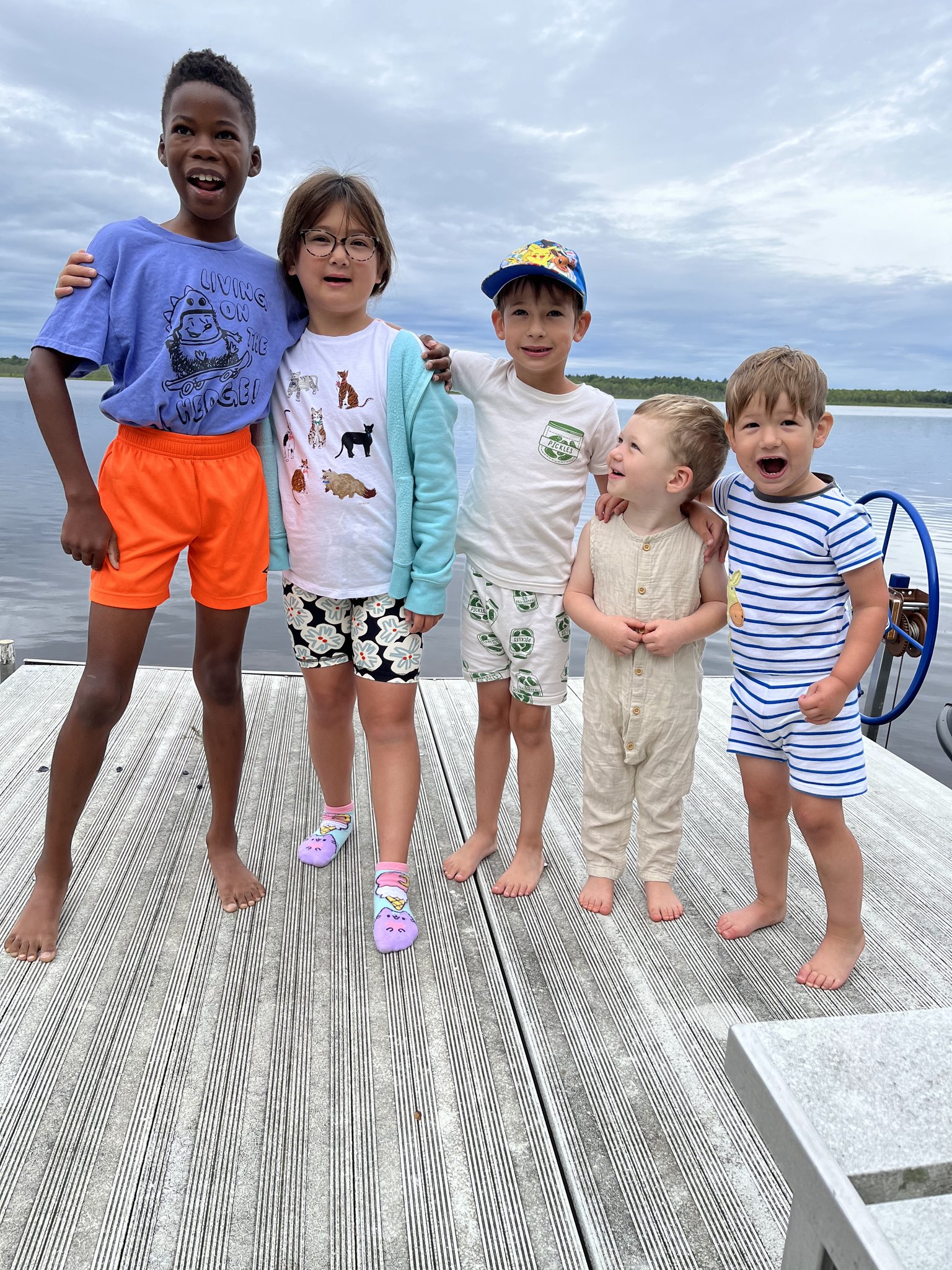 Kids laughing together on the dock at Loon Lodge